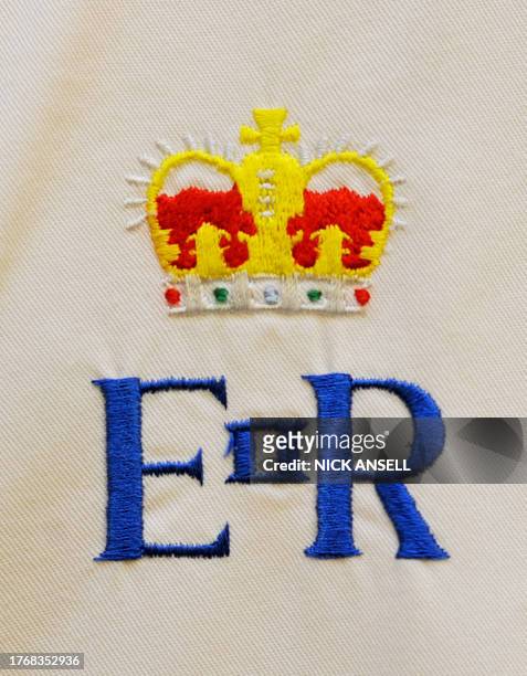 The Royal Crest on the chef whites of staff working in the kitchens at Buckingham Palace in London on March 25 as preparations for the forthcoming...