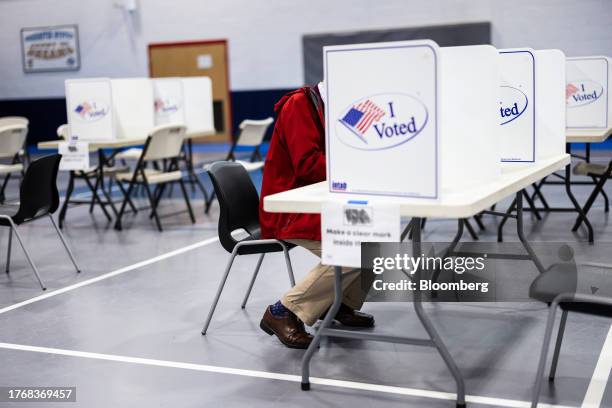 Voter casts a ballot at a polling location in Alexandria, Virginia, US, on Tuesday, Nov. 7, 2023. All 140 state legislative seats are at stake in...