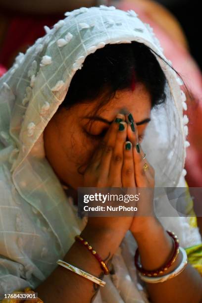 Devotees offer prayers at the Shri Shri Lokanath Brahmachari temple during the Hindu religious fasting festival of 'Rakher Upobash' in Dhaka,...