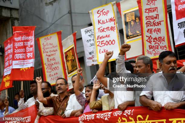 Garment workers and activists participate in a protest in Dhaka, Bangladesh on November 7, 2023. Police use tear gas as thousands of workers set a...