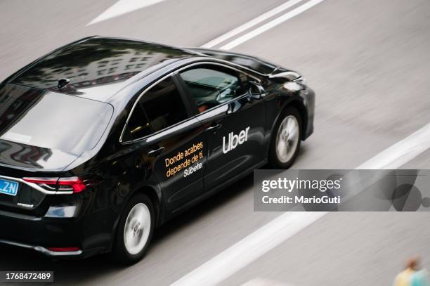 uber car - uber taxi app in madrid stock pictures, royalty-free photos & images