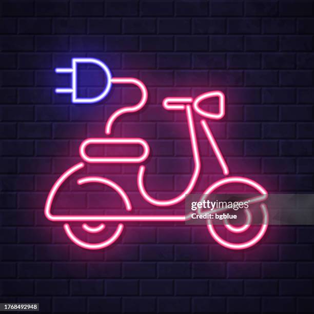 electric scooter motorcycle with plug. glowing neon icon on brick wall background - plug in night light stock illustrations