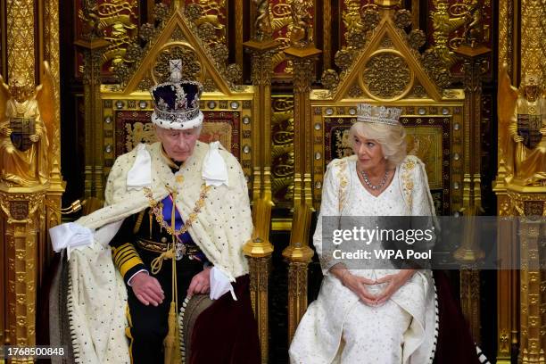 Britain's King Charles III sits besides Queen Camilla during the State Opening of Parliament at the Houses of Parliament on November 7, 2023 in...