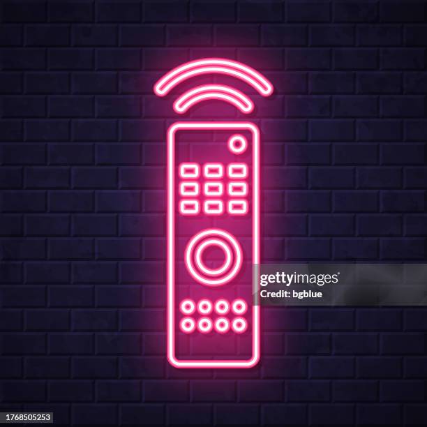 remote control. glowing neon icon on brick wall background - shiny square button stock illustrations
