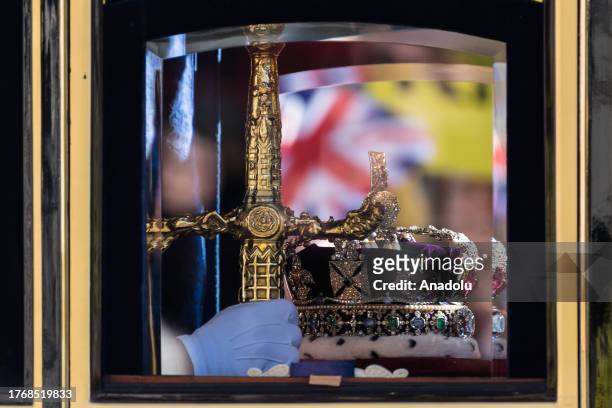 Coach is seen carrying the Imperial State Crown and the Great Sword of State travels along Whitehall to the Houses of Parliament for the State...