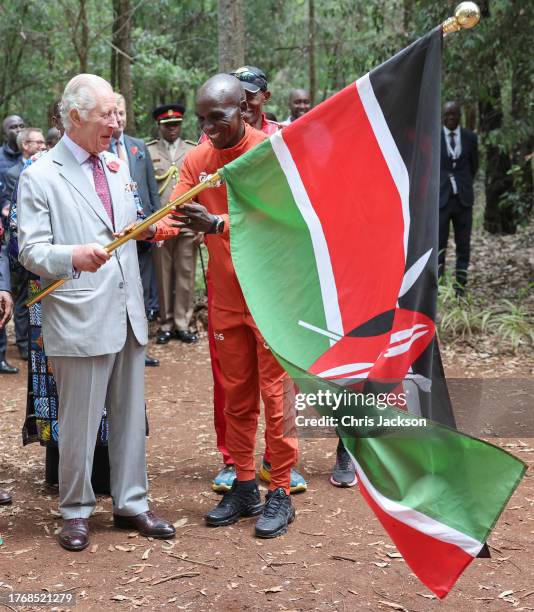 King Charles III with Kenyan marathon runner Eliud Kipchoge, as they flag off to start a 15km "Run for Nature" event during a visit to Karura urban...