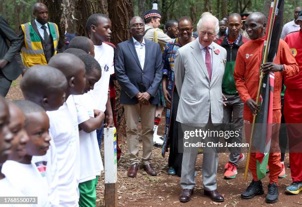 King Charles III views the runners with Kenyan marathon runner Eliud Kipchoge , as they flag off to start a 15km "Run for Nature" event during a...