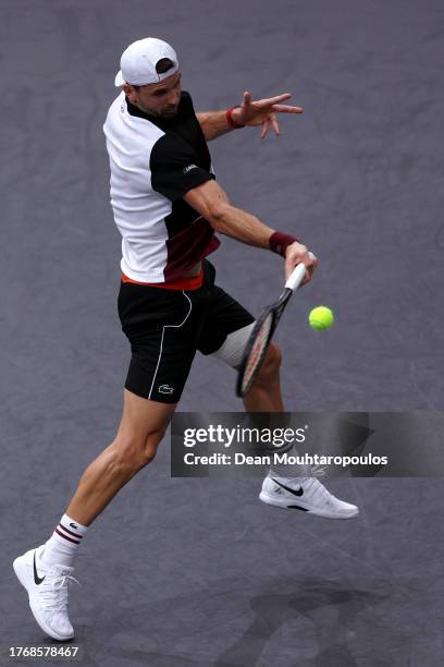 Grigor Dimitrov of Bulgaria returns a forehand in his match against Daniil Medvedev of Russia during Day Three of the Rolex Paris Masters ATP Masters...