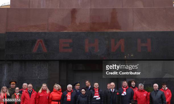 Russian Communist Party Chairman Gennady Zyuganov and his party's leaders pose for a photo in front of the Lenin's Mausoleum during a rally, November...