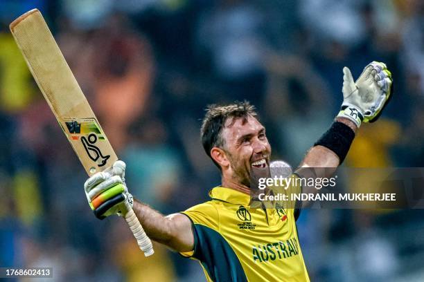 Australia's Glenn Maxwell celebrates after winning the 2023 ICC Men's Cricket World Cup one-day international match between Australia and Afghanistan...