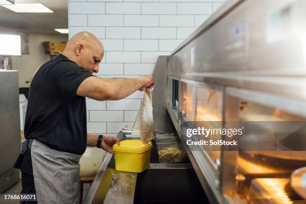 freshly fried fish - deep fried stock pictures, royalty-free photos & images