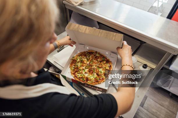 boxing up the pizza - pizza stock pictures, royalty-free photos & images