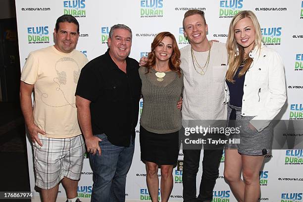 The cast of "The Elvis Duran Z100 Morning Show" poses with Macklemore at Z100 Studio on August 16, 2013 in New York City.