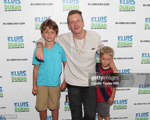 Rapper Macklemore poses with young fans at "The Elvis Duran Z100 Morning Show" at Z100 Studio on August 16, 2013 in New York City.