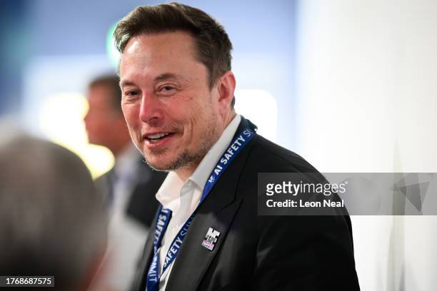 SpaceX, X , and Tesla CEO Elon Musk speaks with other delegates during day one of the AI Safety Summit at Bletchley Park on November 01, 2023 in...