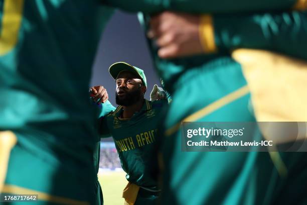 Temba Bavuma of South Africa speaks to their side in the huddle during the ICC Men's Cricket World Cup India 2023 between New Zealand and South...