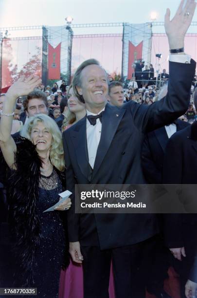 Portia Rebecca Crockett and Peter Fonda attend the 70th Academy Awards at the Shrine Auditorium in Los Angeles, California, on March 23, 1998.