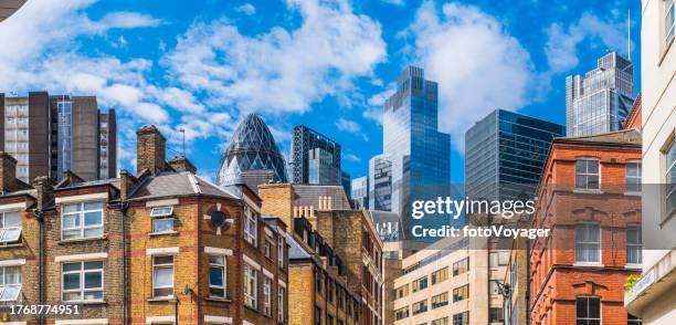 london modern skyscrapers financial district overlooking homes rooftops panorama - shoreditch stock pictures, royalty-free photos & images