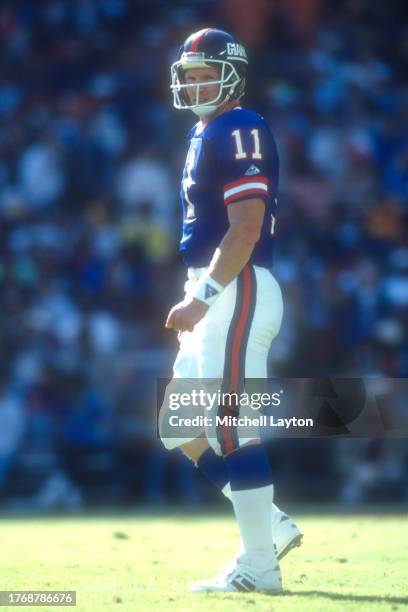 Phil Simms of the New York Giants looks on during a NFL football game against the Washington Redskins on October 10, 1993 at RFK Stadium in...