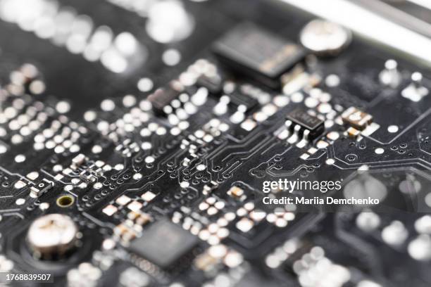 computer circuit board close-up. defocused computer motherboard parts background - capacitors stock pictures, royalty-free photos & images