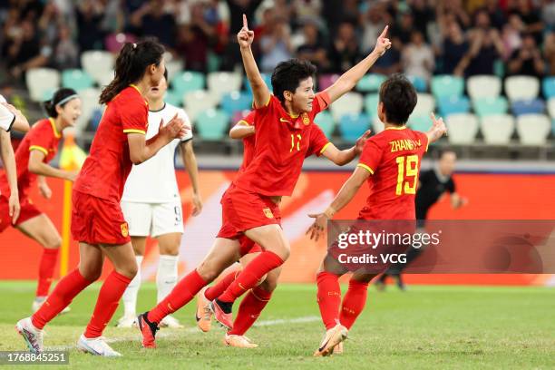 Wang Shanshan of China celebrates after scoring her team's first goal during the AFC Women's Asian Olympic Qualifier Round 2 Group B match between...