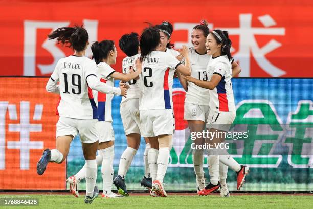 Shim Seo-yeon of South Korea celebrates with team mates after scoring her team's first goal during the AFC Women's Asian Olympic Qualifier Round 2...