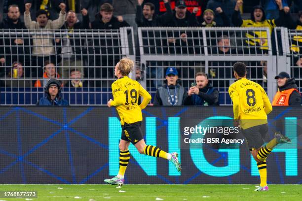 Julian Brandt of Borussia Dortmund celebrates after scoring the team's second goal with Felix Nmecha of Borussia Dortmund during the UEFA Champions...