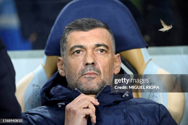 Porto's Portuguese coach Sergio Conceicao looks on as a butterfly flies prior the UEFA Champions League group H football match between FC Porto and...