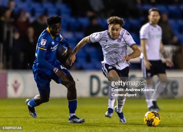 Bolton Wanderers' Dion Charles breaks away from Shrewsbury Town's Nohan Kenneh during the Sky Bet League One match between Shrewsbury Town and Bolton...