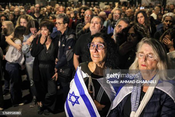 Woman reacts as she attends a protest calling upon the Israeli prime minister to resign and a vigil demanding government action for return of the...