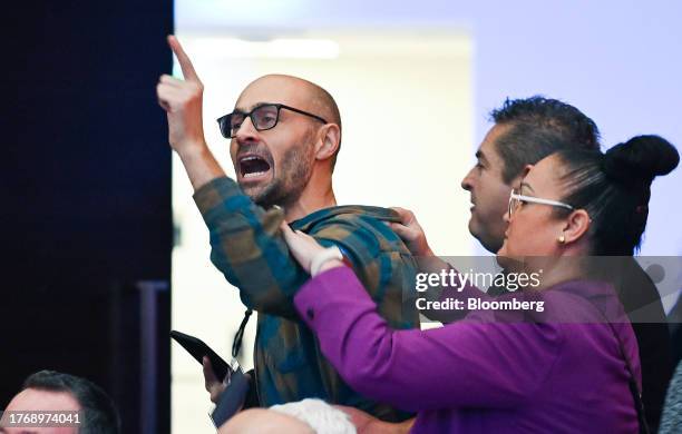 Protester interrupts a speech by Catherine Tait, president and chief executive officer of CBC/Radio-Canada, not pictured, during an event at the...