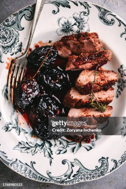 roasted duck breast with prunes - dried plum stock pictures, royalty-free photos & images