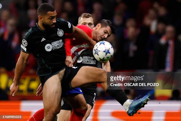 Atletico Madrid's Spanish forward Alvaro Morata fights for the ball with Celtic's American defender Cameron Carter-Vickers during the UEFA Champions...