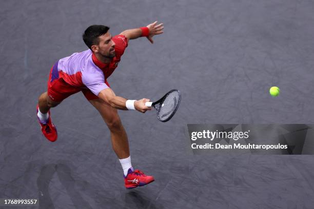 Novak Djokovic of Serbia returns a forehand in his match against Tomas Martin Etcheverry of Argentina during Day Three of the Rolex Paris Masters ATP...