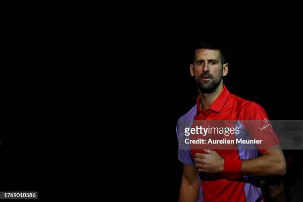 Novak Djokovic of Serbia looks on as he arrives on the court for his second round men's single match against Tomas Martín Etcheverry of Argentina...