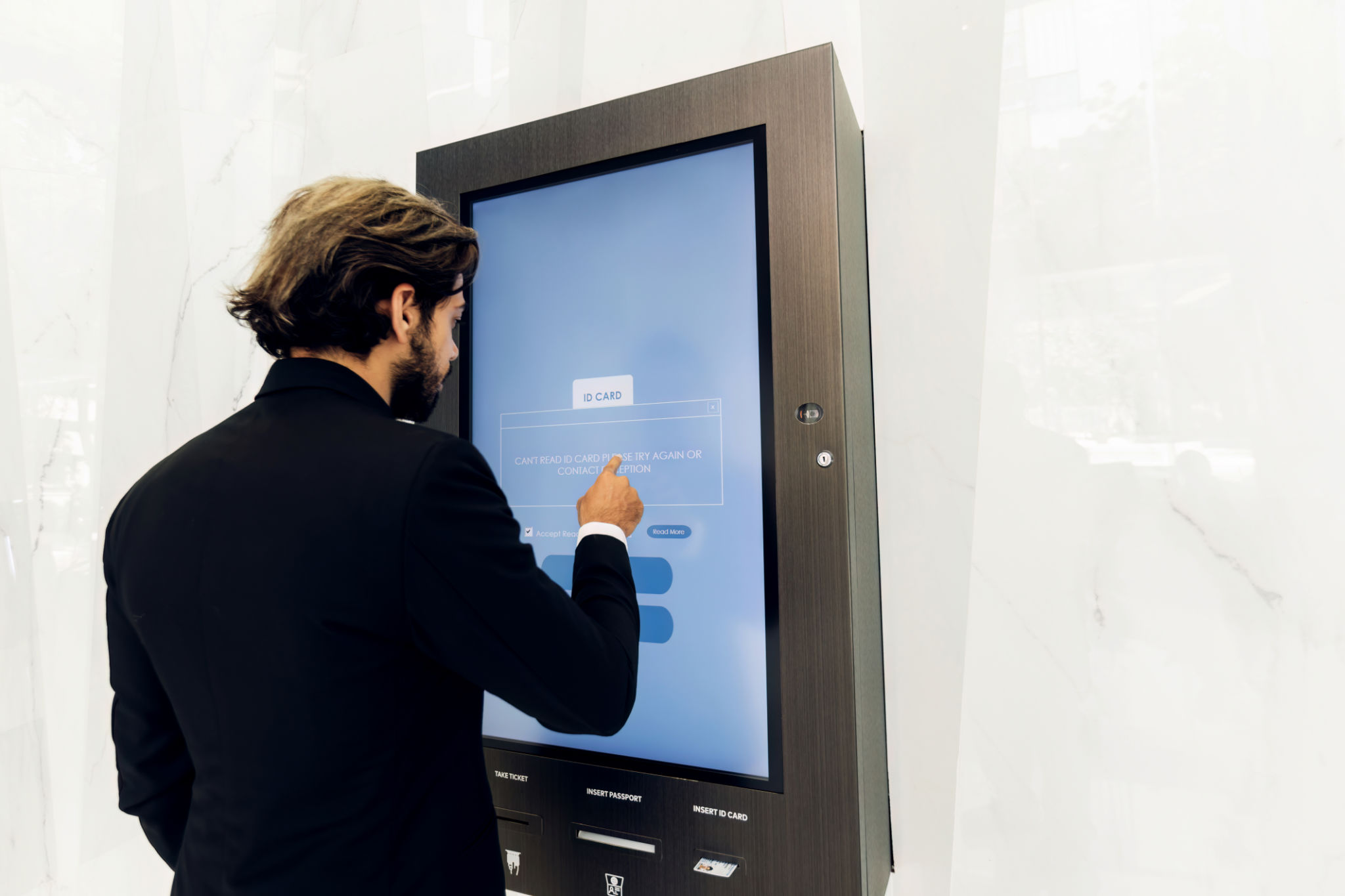 Businessman using card to open automatic gate machine in office building. Male using smart card to open automatic gate machine in office building. Working routine concept. Businessman using card to open automatic gate machine in office building. Male using smart card to open automatic gate machine in office building. Working routine concept.