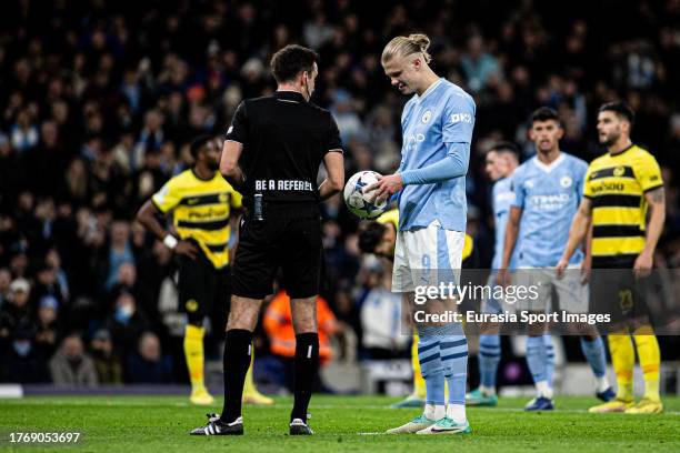 Erling Haaland of Man City talks to referee Erik Lambrechts during the UEFA Champions League Group Stage match between Manchester City and BSC Young...