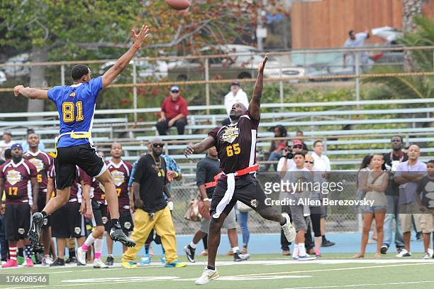 Former NFL player Marcellus Wiley and NBA player Ryan Hollins participate in the 1st Annual Athletes VS Cancer Celebrity Flag Football Game on August...