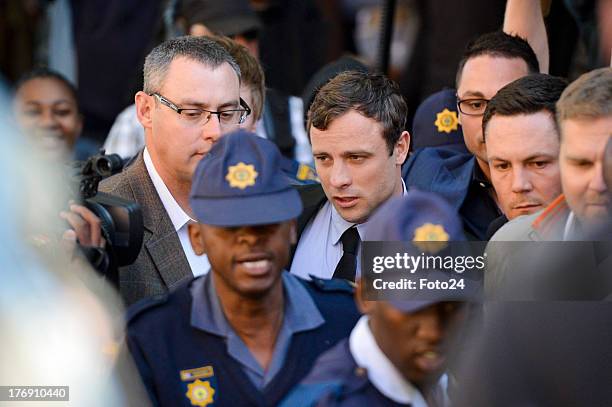 Oscar Pistorius arrives at the Pretoria Magistrates court on August 19 in Pretoria, South Africa. Pistorius is accused of the murder of Reeva...
