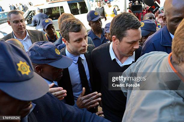 Oscar Pistorius arrives at the Pretoria Magistrates court on August 19 in Pretoria, South Africa. Pistorius is accused of the murder of Reeva...