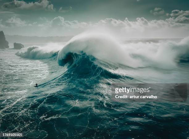 big wave in nazaré, portugal. drone photography - drone images stock-fotos und bilder