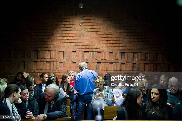 Family members of Oscar Pistorius and friends of Reeva wait in the Pretoria Magistrates court on August 19 in Pretoria, South Africa. Pistorius is...