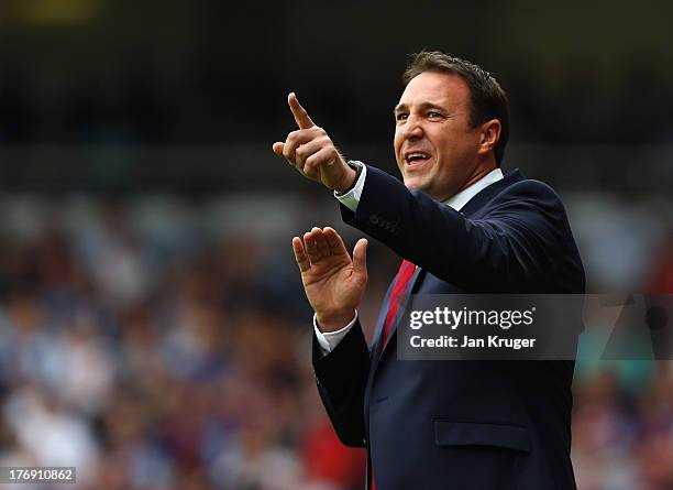 Manager of Cardiff City, Malky Mackay looks on during the Barclays Premier League match between West Ham United and Cardiff City at the Bolyen Ground...