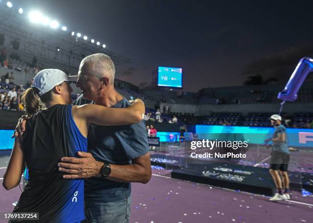 Iga Swiatek of Poland seen with her father Tomasz Swiatek at the end of the Awards Ceremony, after she won against Jessica Pegula of the USA during...