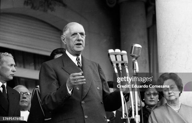 French President Charles de Gaulle gives a speech at the French Embassy during a State Visit, Buenos Aires, Argentina, 1964. Among those behind him...
