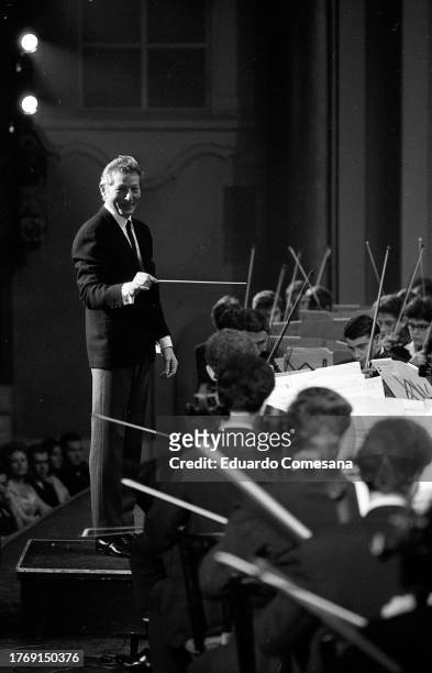 American actor and dancer Danny Kaye conducts the Gadna Israeli Youth Orchestra during a performance at the Cine Teatro Opera, Buenos Aires,...