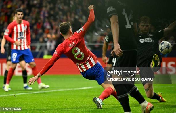 Atletico Madrid's Spanish midfielder Saul Niguez scores his team's sixth goal during the UEFA Champions League group E football match between Club...