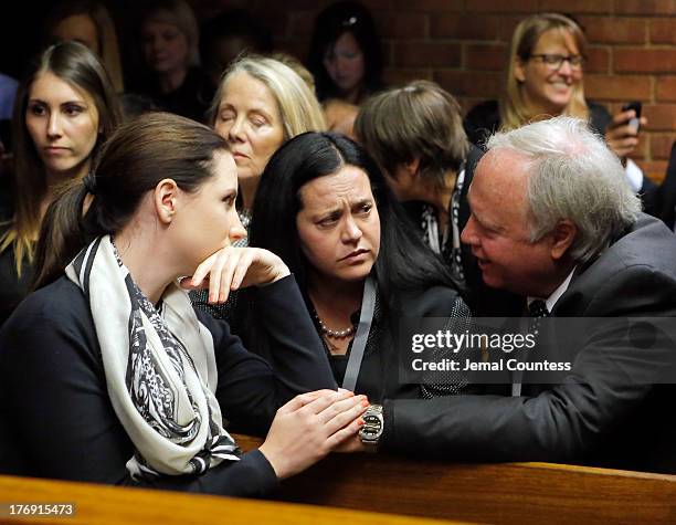 Aimee Pistorious is comforted by Theo Pistorious prior to the indictment hearing for South African athelete Oscar Pistorius at Pretoria Magistrates...