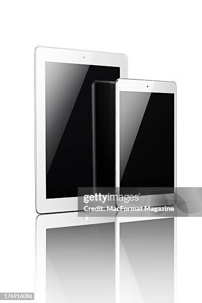 Front view of the iPad 4 and iPad Mini in white and silver, November 22, 2012.