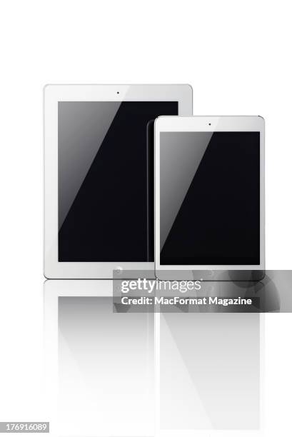 Front view of the iPad 4 and iPad Mini in white and silver, November 22, 2012.